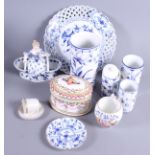 A Meissen double salt decorated in blue and white with a figure of a woman holding a bunch of