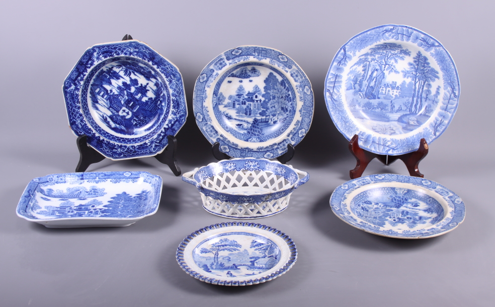 An early 19th century blue and white transfer decorated chestnut basket, a similar osier plate, four