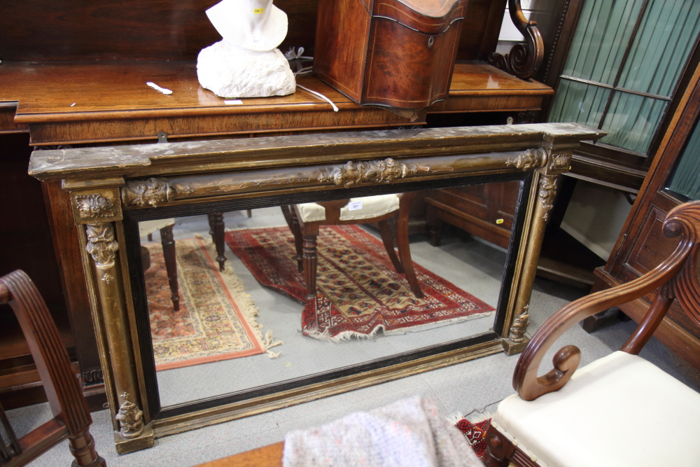 An early 19th century gilt framed over mantel mirror with flanking columns, plate 45" x 22"