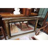 An early 19th century gilt framed over mantel mirror with flanking columns, plate 45" x 22"