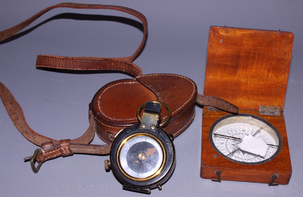 A WWI prismatic compass by John Wardale, in leather case, and another compass, in mahogany case