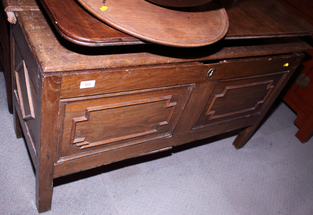 An 18th century oak blanket box with two panel front decorated mitred mouldings, 45" wide
