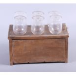 A set of six 19th century glass toddy lifters, in hardwood stand (some damages)