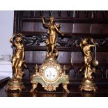An early 20th century French gilt metal clock garniture with figures of Diane, Coup de Soleil and