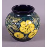 A Moorcroft "Buttercup" pattern vase, 3" high