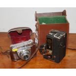 A Midas combined camera projector, in leather case complete with instructions, and a Kodak camera