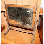 A 19th century mahogany framed toilet mirror with brass urn finials, 17" wide, and a similar smaller