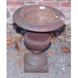 A cast iron garden urn, 18" high