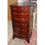 A Georgian design mahogany serpentine front chest of six drawers, 31" wide