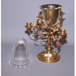 A gilt brass three-light and floral relief decorated table centre with two glass and one brass