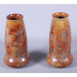 A pair of early 20th century Royal Doulton stoneware vases, "Autumn Leaves", shape number 5746,