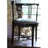 An early 20th century polished as mahogany corner chair with circular seat inset floral gros point
