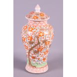 A Chinese polychrome enamelled jar and cover with flowering tree decoration, 10 1/2" high