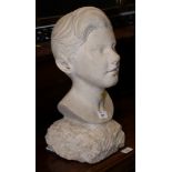 A carved stone portrait bust of a young man, 17" high