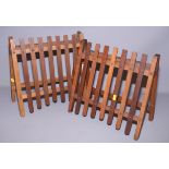 A pair of slatted front wall hung magazine holders