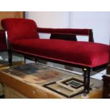 A late 19th century dark stained wooden scroll-end couch, upholstered in a red velour, 66" long