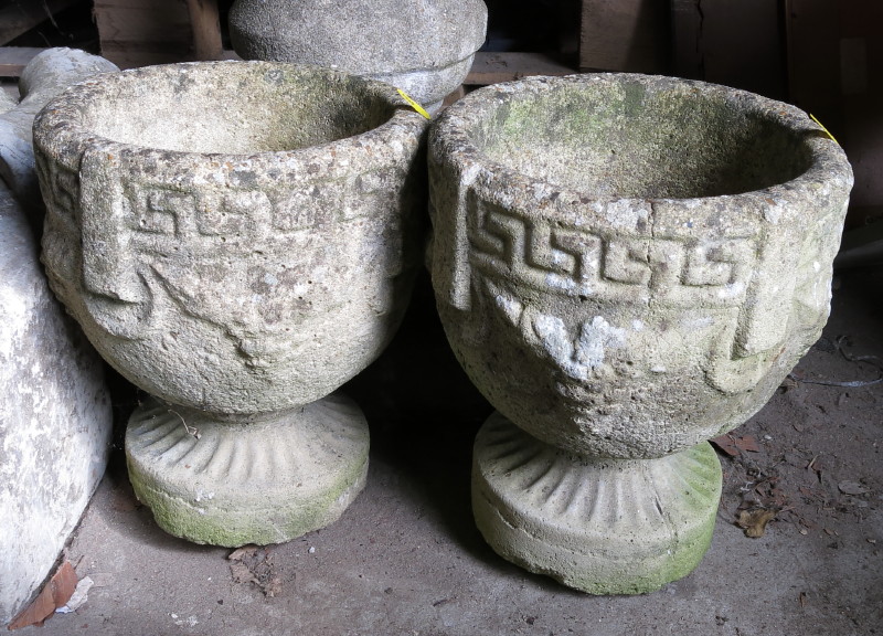 A pair of cast stone planters with Greek key design, 11" high, a carved sandstone slab, 28" high,