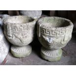 A pair of cast stone planters with Greek key design, 11" high, a carved sandstone slab, 28" high,