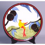 A Clarice Cliff centenary limited edition plate, 325/1999, and a Goebel's figure group after