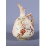 A late Victorian Royal Worcester blush ivory porcelain ewer, shape number 1668, with gilt handle,