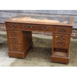 An early 20th century stained as mahogany twin pedestal desk, 48" wide (for restoration)