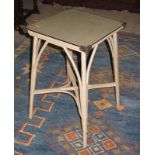 A Lloyd Loom type table with plate glass protector and a Lloyd Loom linen basket with faux leather