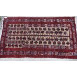 A prayer rug with tree design on a fawn ground, 56" x 32" approx