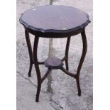 A polished as mahogany circular shaped top two-tier occasional table, 22" dia, and a nest of three