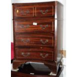 A well reproduced mahogany chest of four drawers with concave fronts, 19" wide