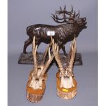 A 19th century bronzed metal statue of a rutting stag, 8" high (damages), and four pairs of deer