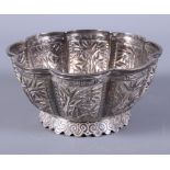 An early 20th century Chinese silver scalloped edge bowl, embossed with bamboo shoot decoration