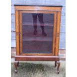 A Victorian walnut and amboyna veneered pedestal cabinet, three red velour covered shelves