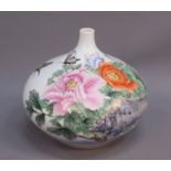 A mid 20th century Chinese porcelain onion-shaped vase, decorated with flowers and butterflies,