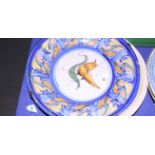 An 18th century Continental polychrome Delftware dish with bird and fruit decoration, 12 1/4" dia (