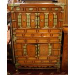 A Korean elm two-stage cabinet, fitted drawers and cupboards, on low stand, 36" wide