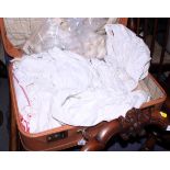 Assorted table linen, in suitcase