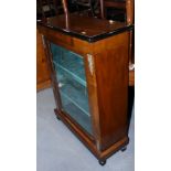A late 19th century walnut, inlaid and ebonised pier cabinet enclosed glazed panel door, on taper