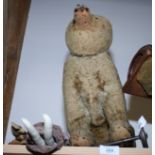 An early 20th century plush covered pull-along bear, a stuffed fabric doll, etc