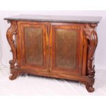 Attributed to Gillows: a Regency rosewood and brass inlaid marble top cabinet, the interior fitted