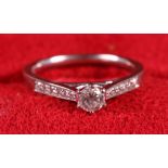 A Canadian Ice 18ct white gold and diamond engagement ring, central stone approx 0.15ct, flanked six
