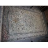A Persian rug with all over scrolling leaf design, in shades of cream, fawn, blue, brown and