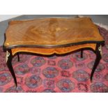 A mahogany shaped top coffee table with marquetry decoration and glass protector, 34" x 22"