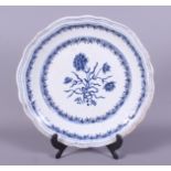 A late 18th century Chinese blue and white pottery charger, designed in the European shape,