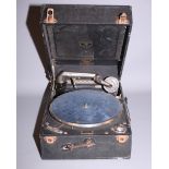 An HMV portable record player, in leatherette case, and a case of 78 rpm records