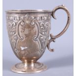 A late Victorian silver christening mug, Sheffield 1897, with 'S' scroll handle, raised on a