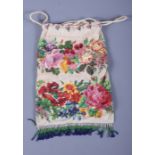 A 1920s/1930s beadwork drawstring bag, decorated with bags, 11" x 7 1/2"