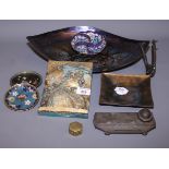 A Ouvet: a French Art Deco metal desk inkwell and pen rest, decorated WWI tin hat, three small