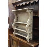 An 18th century carved and painted pine four-tier open wall shelf, 27" wide