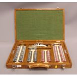 An optician's trial lens set, in fitted oak case