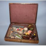 Three wood and brass fishing reels and various other fishing equipment, in oak box